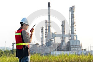 Asian man worker and engineer electrician work safety control at power plant energy industry, people work Thailand.