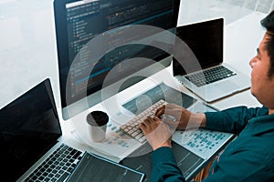 Asian man working code program developer computer web development working design software on desk in office
