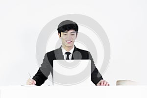 Asian manager businessman sitting at desk and working, isolated