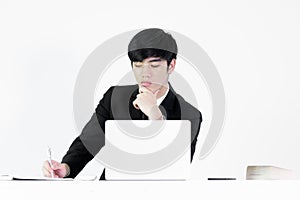 Asian manager businessman sitting at desk and working, isolated