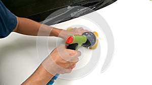 Asian Mans Hand Cleaning Front Bonnet Car With Sponge And Squirt Water Hose