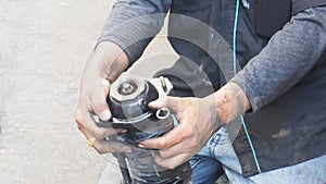 Asian mechanic service industry of transportation, he to do the shock absorber replacement