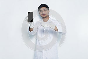 Asian medical doctor demonstrating mobile cell phone isolated on white background