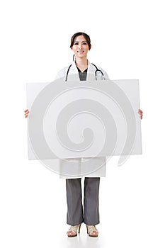 Asian medical doctor hold a blank board