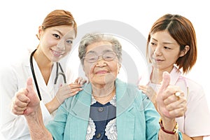 Asian medical staff with old women