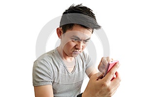 Asian men are angry, frustrated and angry at social media. Behaving aggressively with his phone on a white background .Health