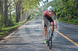 Asian men are cycling road bike