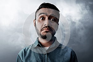 Asian men funny face on smoke background