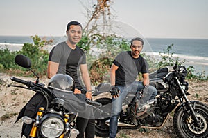 asian men rider sitting motorbike touring countryside