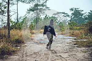 Asian men travel photograph nature. Travel relax. Walk on the path. Nature Study in the Jungle. Thailand