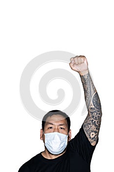 Asian men is wear a medical mask and showing a hand with fist up in white background with copy space above.The concept of protest