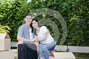 Asian men and women couple moving into a new home.