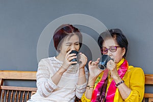 Asian middle aged daugther takecare senior mother at home