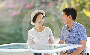 Asian middle-aged man leisure to his wife