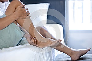 Asian middle aged man suffering from shin splints or medial tibial stress syndrome and achilles tendinitis,inflammation of muscle,