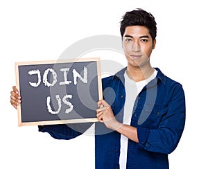 Asian mixed Indian man with blackboard showing a phrase of join
