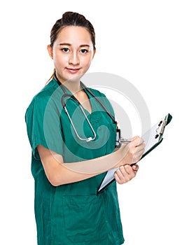 Asian mixed race doctor write on clipboard