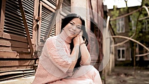 Asian model sitting on a stairs posing on photo session