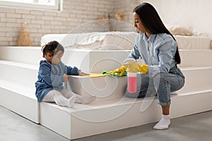 Asian Mom And Toddler Baby Daughter Cleaning At Home
