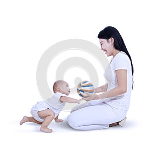 Asian mother and baby playing ball - isolated