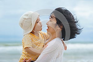 Asian mother and child at the beach