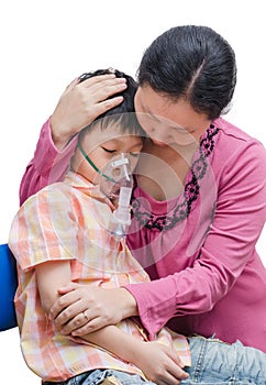 Asian mother comforts her son