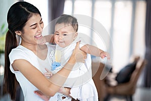 Asian mother and her baby play togather