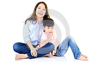 Asian mother and her son indoor portrait