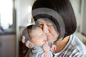 Asian mother with newborn baby in the hospital