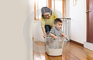 Asian Mother playing with little son