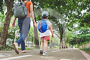 Asian Mother walking with her son