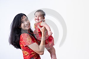 Asian mother wearing chinese dress with baby