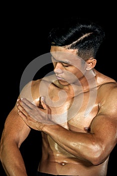 Asian muscle men posing muscle front on the black background. Body gym big chest and shoulder and bicep. Healthy fitness body type