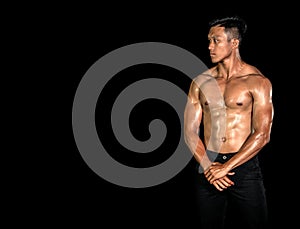 Asian muscle men posing muscle front on the black background. Body gym big chest and shoulder and bicep. Healthy fitness body type