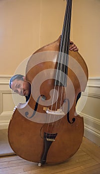 Asian Musician with his Upright String Bass