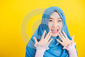 Asian Muslim Arab woman Islam wear hijab she shocking open mouth touching her cheeks