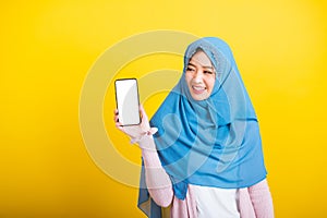 Asian Muslim Arab woman Islam wear veil funny smile she showing blank screen smart mobile phone