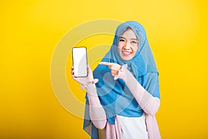 Asian Muslim Arab woman Islam wear veil funny smile she showing blank screen smart mobile phone