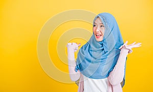 Asian Muslim Arab woman Islam wear veil she victories expression raises hands glad excited cheerful