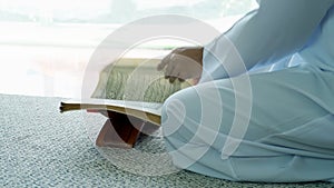 Asian Muslim Family Praying and Prostrating at Home