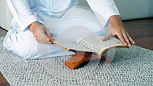 Asian Muslim Family Praying and Prostrating at Home