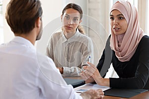 Asian muslim female hr manager interviewing applicant consulting client photo