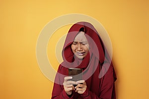 Asian Muslim Teenage Girl Crying Sad When Receiving Bad News on Phone