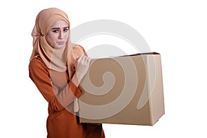 Asian Muslim woman carrying boxes