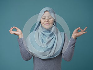 Asian Muslim Woman Doing Relaxing Yoga