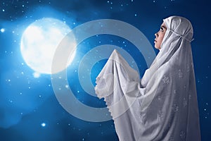 Asian muslim woman pray to god