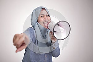 Asian muslim woman Shouting with Megaphone, Leader, Supporter or Protester