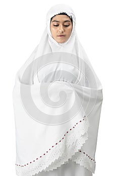Asian Muslim woman in veil in praying position salat
