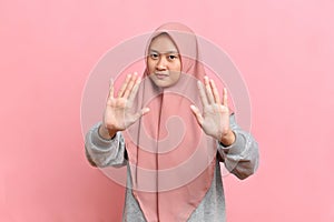 Asian Muslim woman Woman showing stop gesture