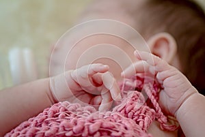 asian new born baby`s hand